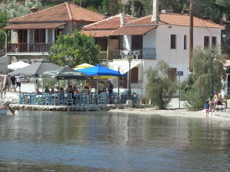 Visitors enjoy their food in a traditional tavern in Lefokastro