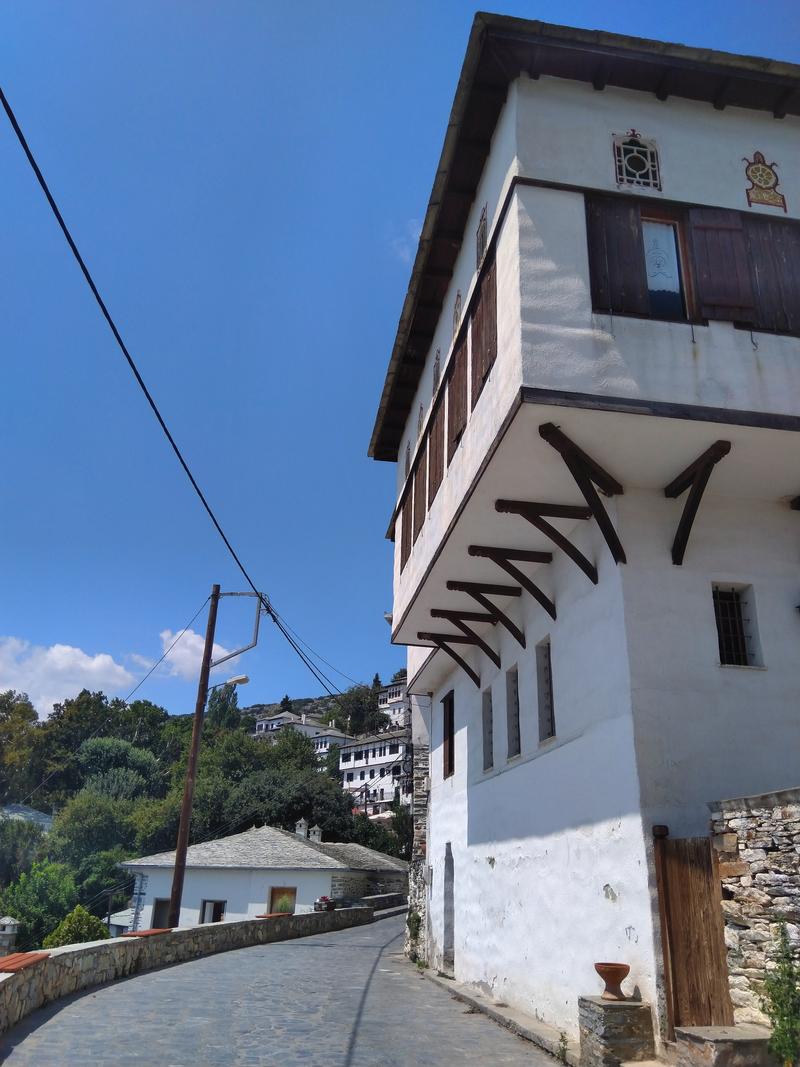 House of traditional Pelion architecture on the cobbled path