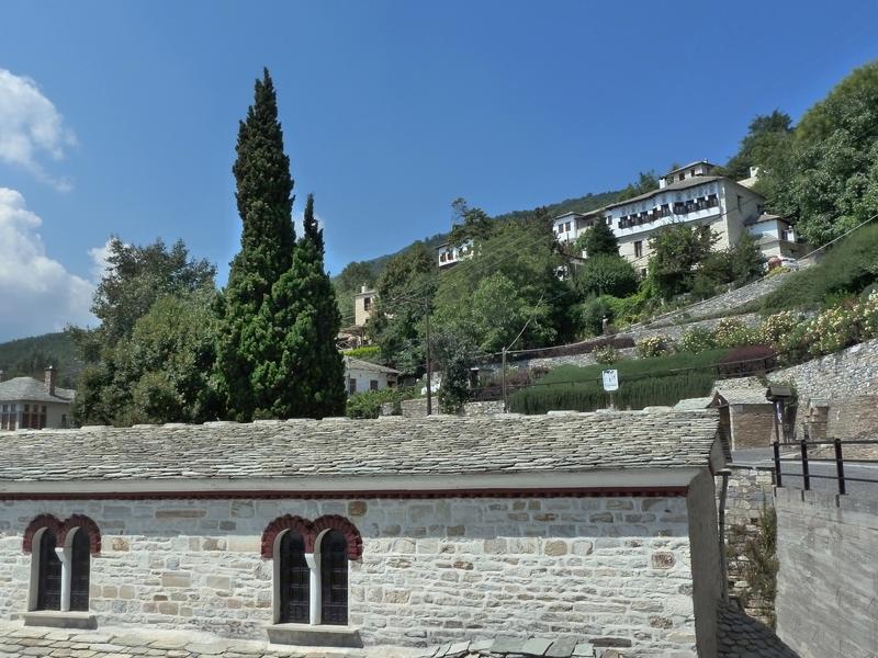 Verdant landscape with traditional buildings of Pelion traditional architecture